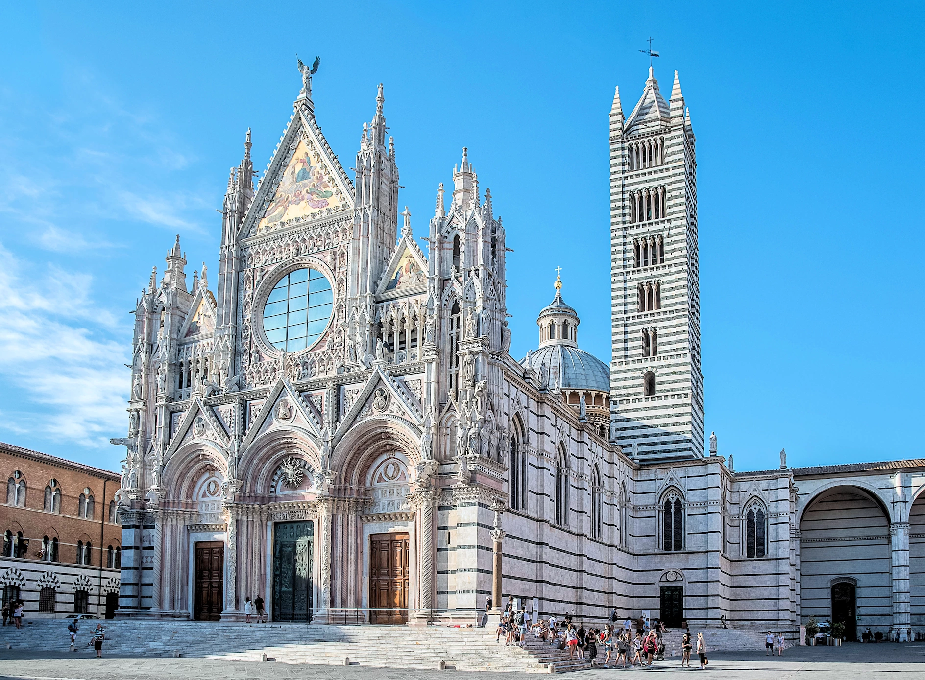Explore Siena, Italy's enchanting medieval hill town. Witness the breathtaking Piazza del Campo, climb the Torre del Mangia for panoramic views, and marvel at the Duomo's artistic treasures.  Indulge in delicious Tuscan cuisine and discover the city's rich history and Palio horse racing tradition.