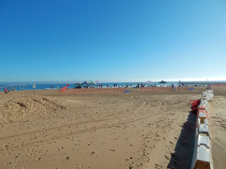 A surfing contest was in progress on the beach, surf was not great but the competitors were working what was there