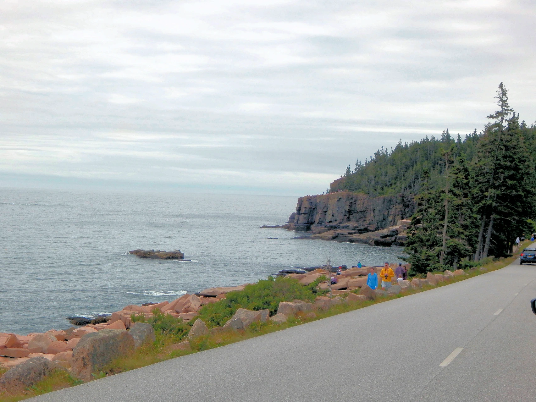 Atlantic swell booms into Schoodic’s granite ledges — the sound carries long before you see the spray.